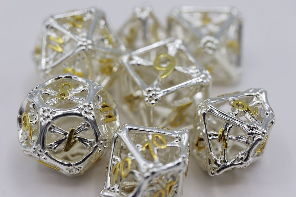 Holy Bones - Hollow Metal RPG Dice Set Metal Dice Foam Brain Games