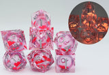 Sharp Edge Glow in the Dark Liquid Core RPG Dice Set - Radiant Pink Plastic Dice Foam Brain Games