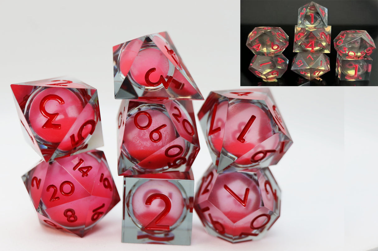 Set of red and clear polyhedral dice with numbers on a white background