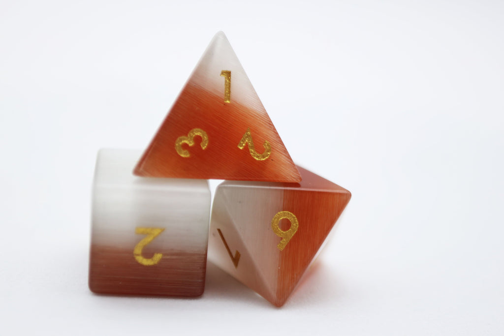 Orange and White Cat's Eye - Gemstone Engraved with Gold Stone Dice Foam Brain Games